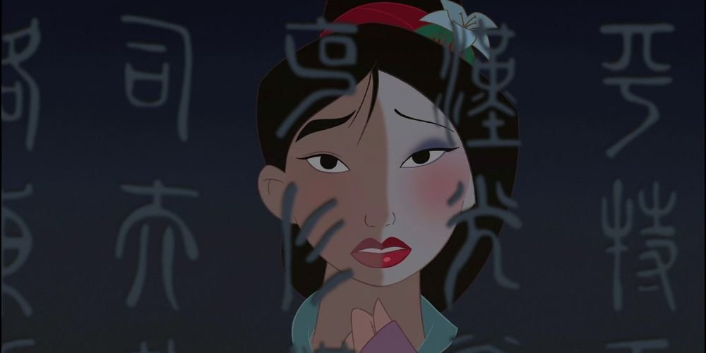 Mulan looking at her reflection in the mirror