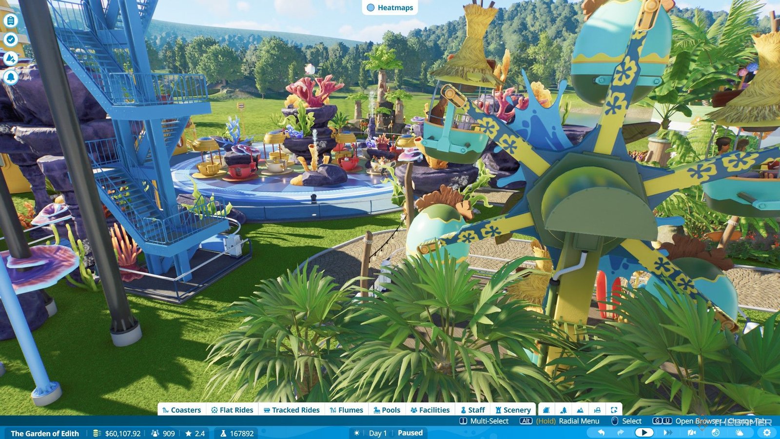 Two flat rides are next to each other in Garden of Edith level in Planet Coaster 2.