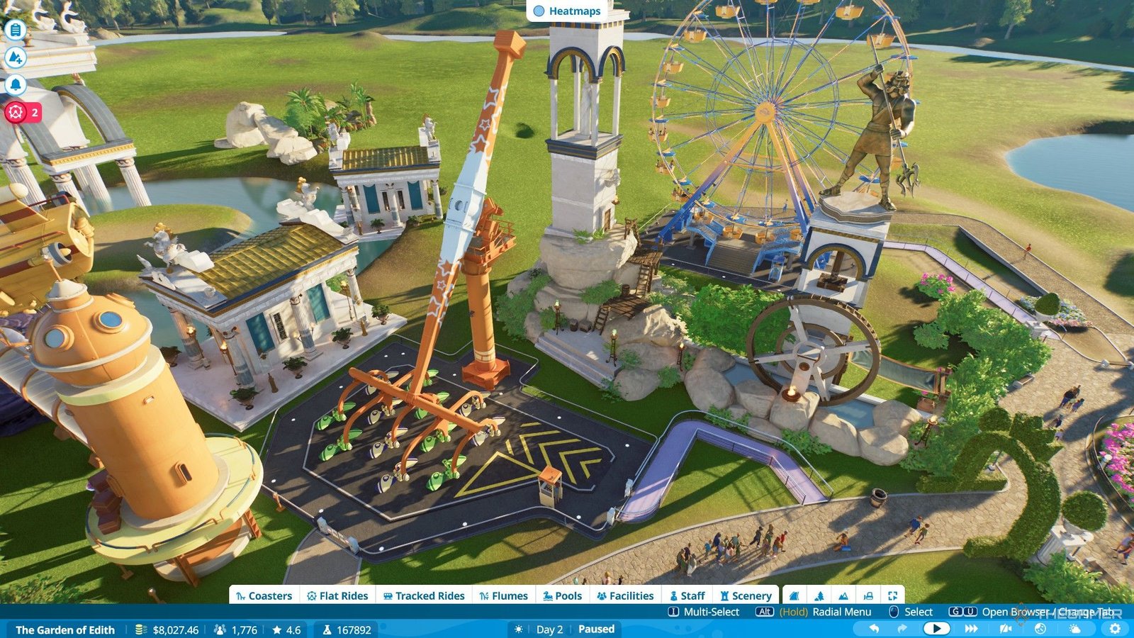 The player builds two more flat rides into well decorated areas inside the park in Planet Coaster 2.