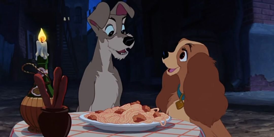 Lady and the Tramp sit with spaghetti happily.