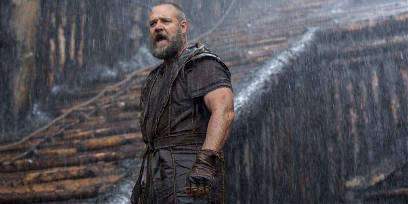 Russell Crowe standing on his Ark as the rain pours down in Noah.