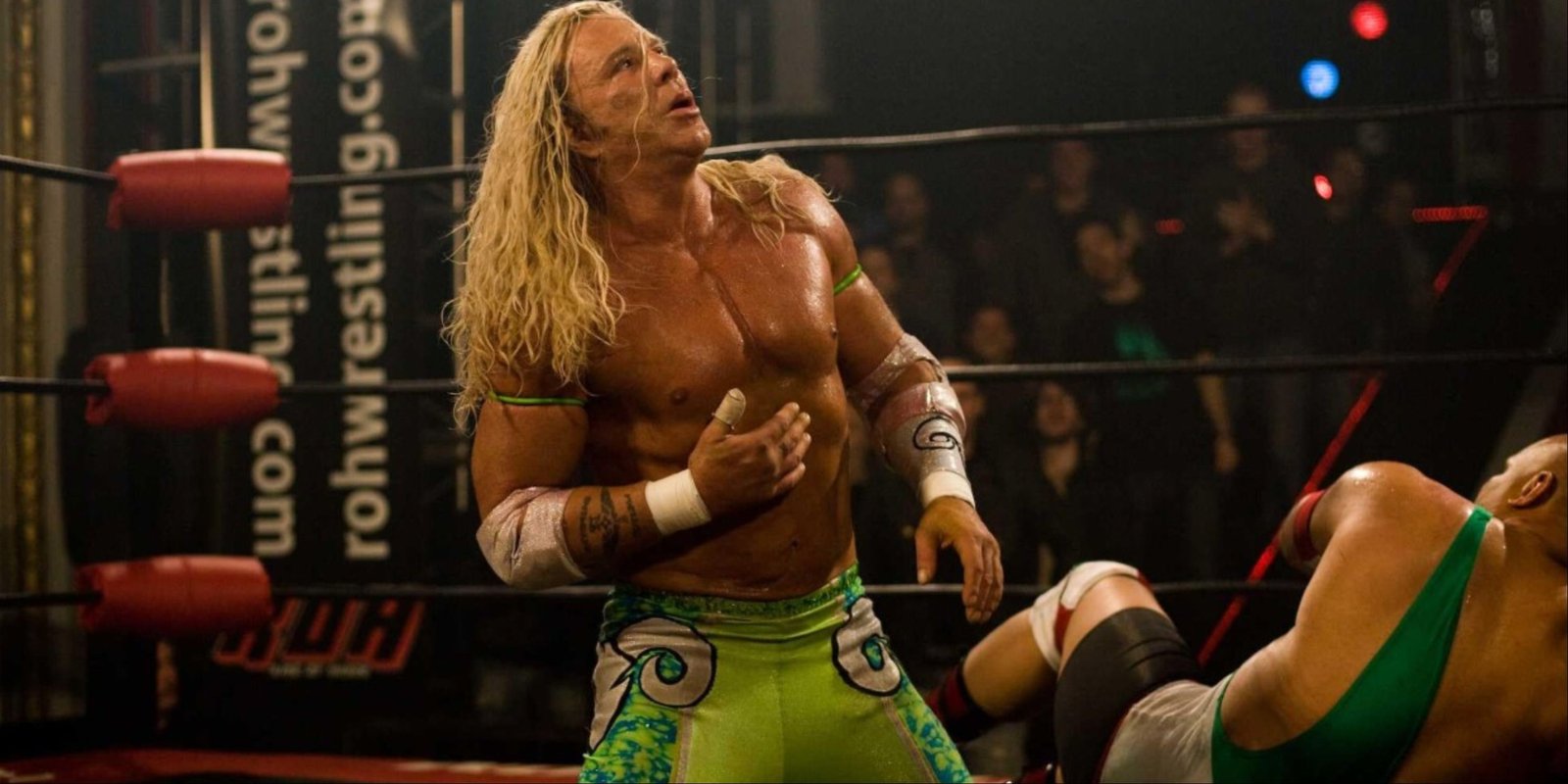 Mickey Rourke in the ring with an opponent as wrestler Randy Robinson in The Wrestler.