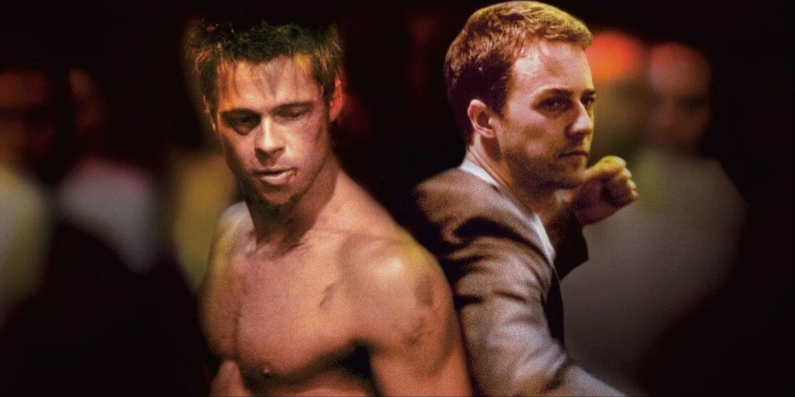 Brad Pitt and Edward Norton standing back to back ready to fight a crowd in Fight Club.