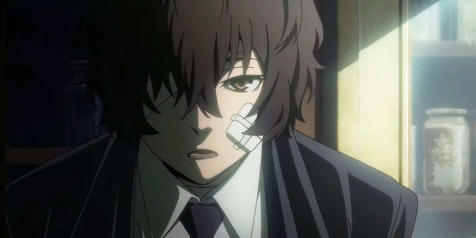Osamu Dazai with a bandage on his cheek in Bungo Stray Dogs