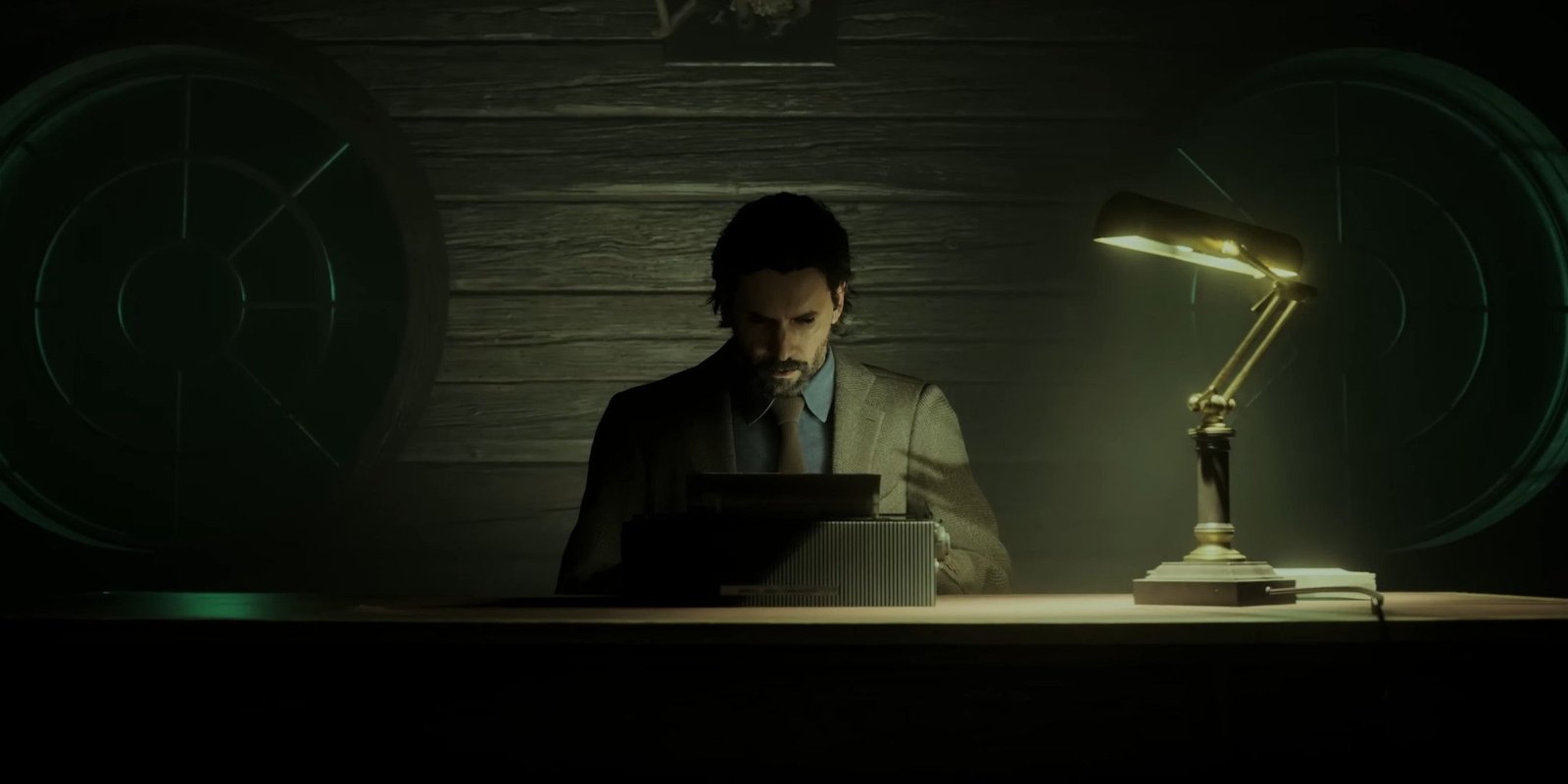 Alan Wake typing at a typewriter on a desk in a dark room.