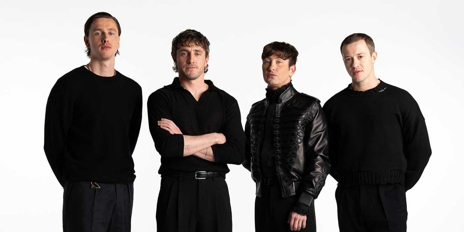 Harris Dickinson, Paul Mescal, Barry Keoghan, and Joseph Quinn dressed in black against a white background.