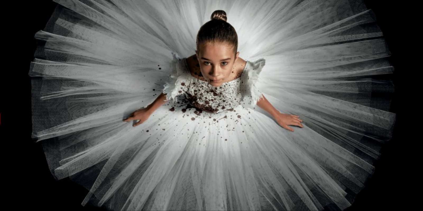 The main art for Abigail featuring the titular vampire ballerina character spinning in a white dress.