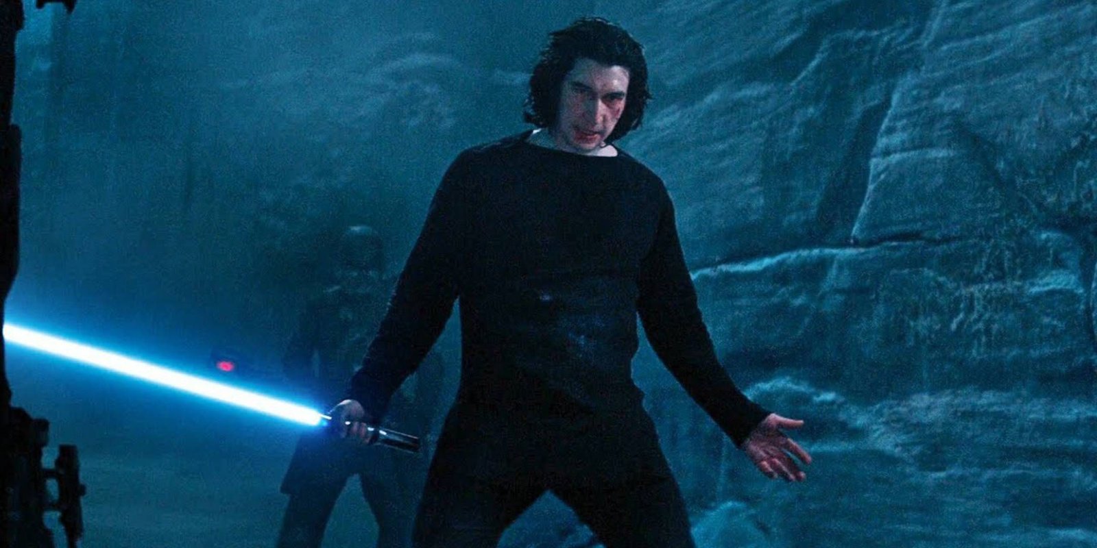 Ben Solo Kylo Ren giving a cocky shrug while holding Rey's lightsaber about to battle the Knights of Ren in Star Wars: Episode 9 - The Rise of Skywalker.