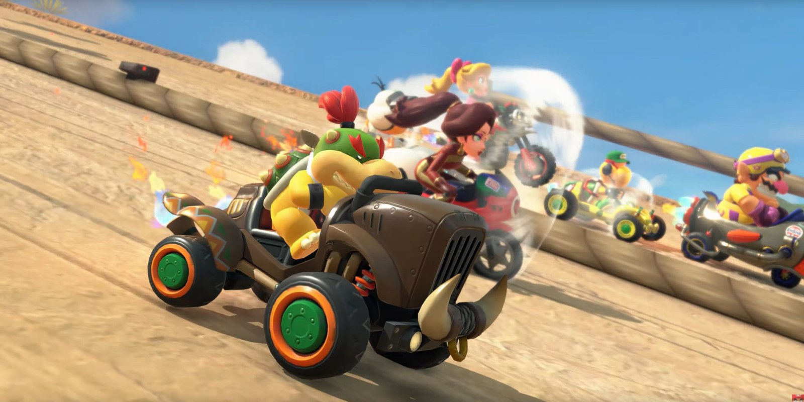 Bowser Jr driving a car next to Paulina on a bike