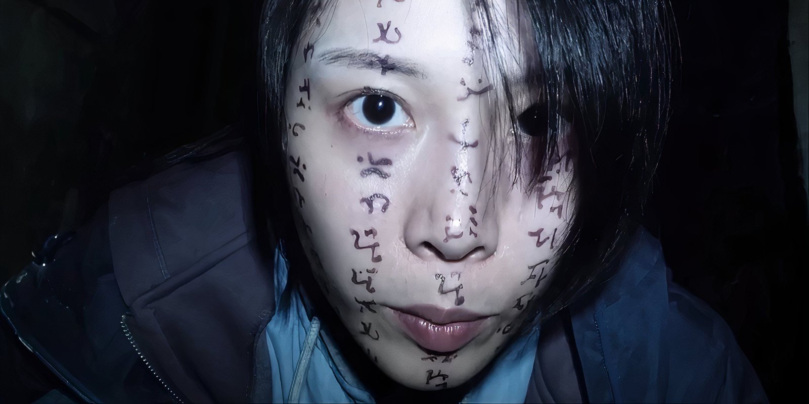 Li Ronan looks into the camera, her face covered in script in Incantation.