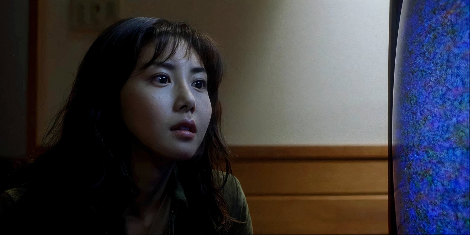 Reiko stares at the TV screen with interest in Ring.