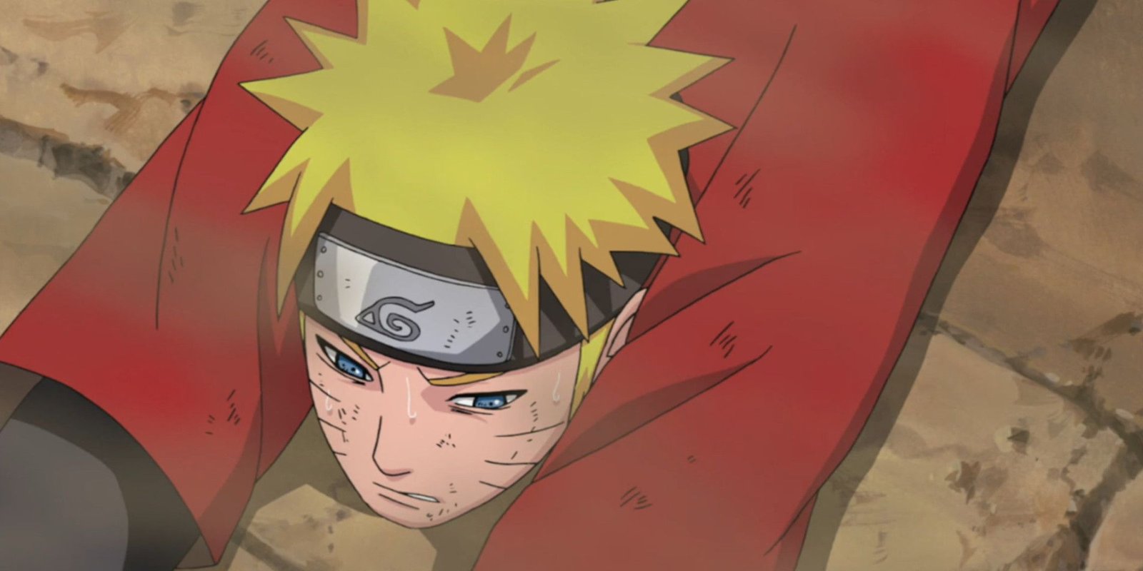 Naruto on the ground looking frustrated and sad.