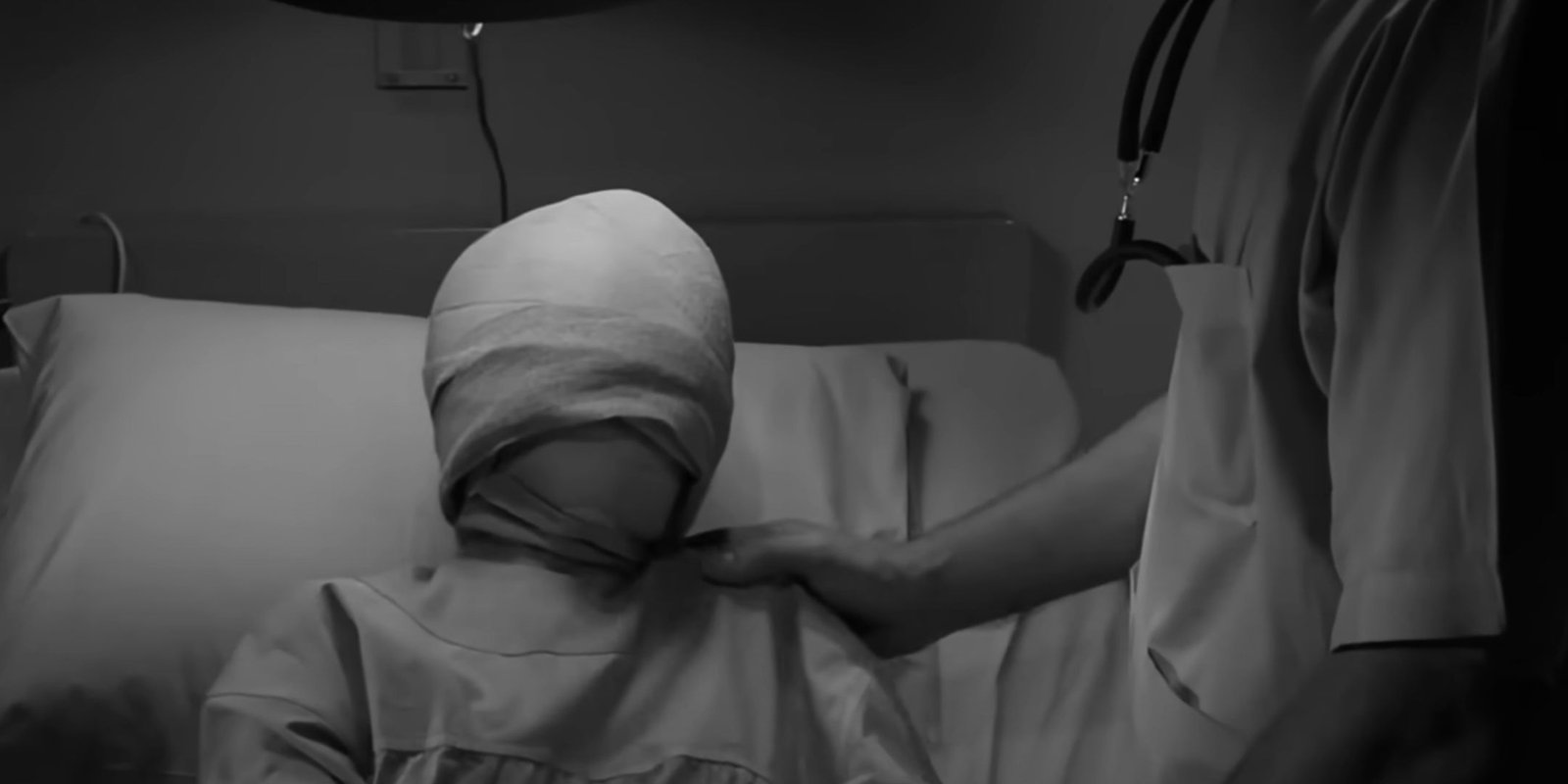 A scene in the Eye of the Beholder where the young woman's face is wrapped in bandages.