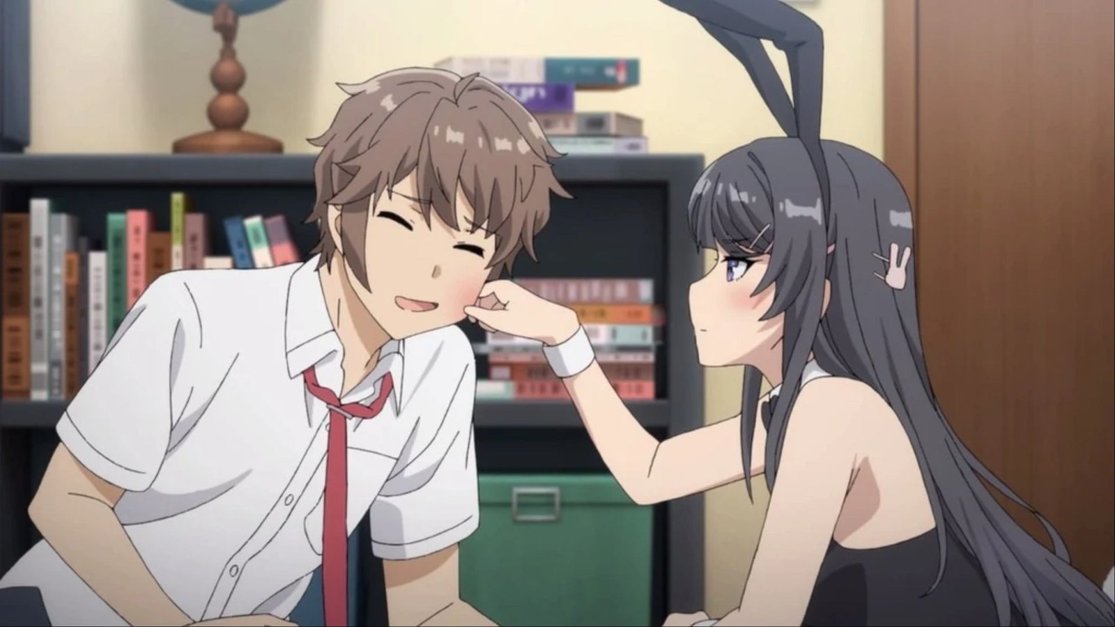Mai Sakurajima pulling on the cheek of Sakuta Azusagawa in Rascal Does Not Dream of Bunny Girl Senpai.
