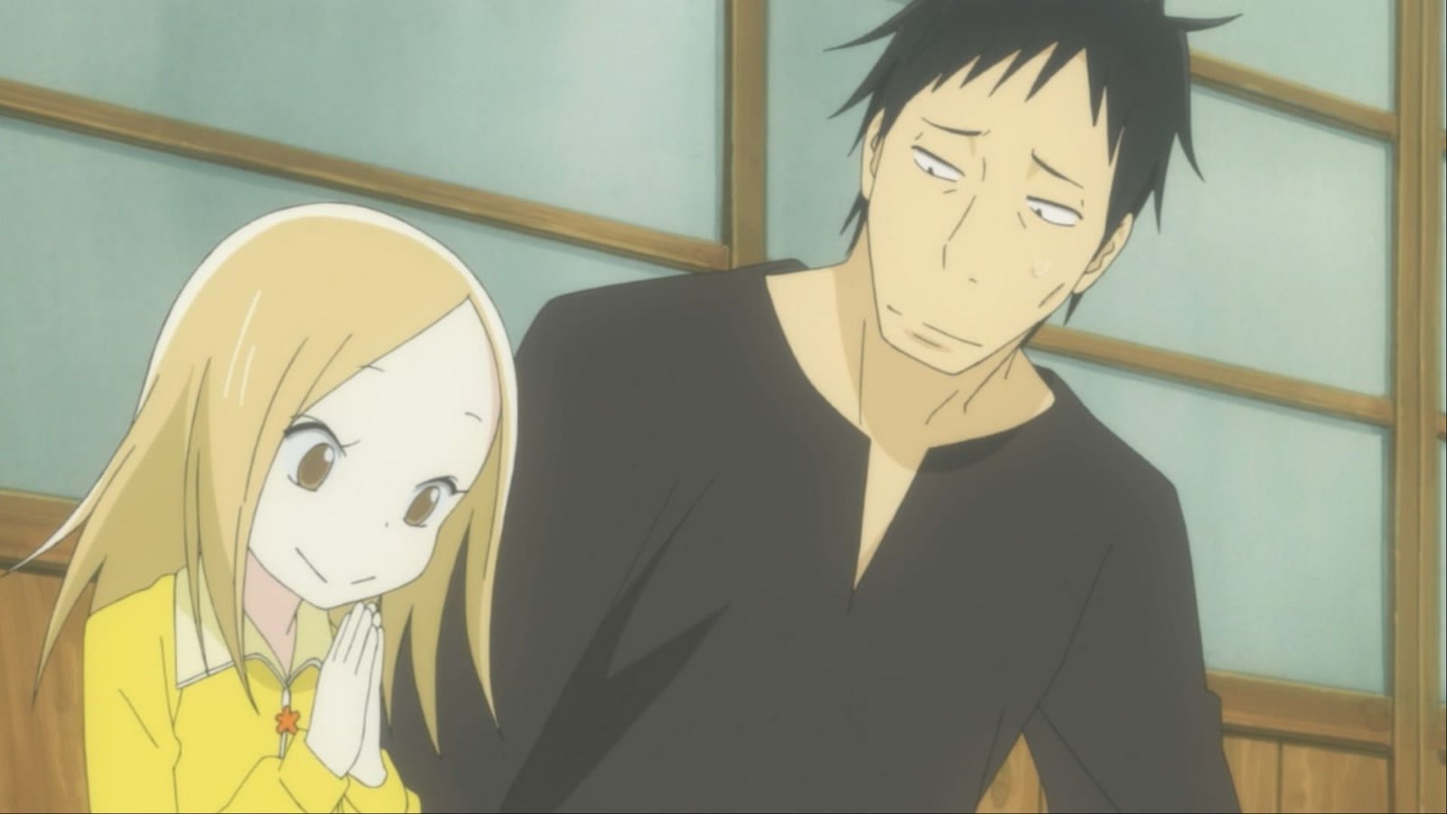 Daikichi Kawachi looking at Rin Kaga with a worrisome expression as she plants a tree in Usagi Drop.