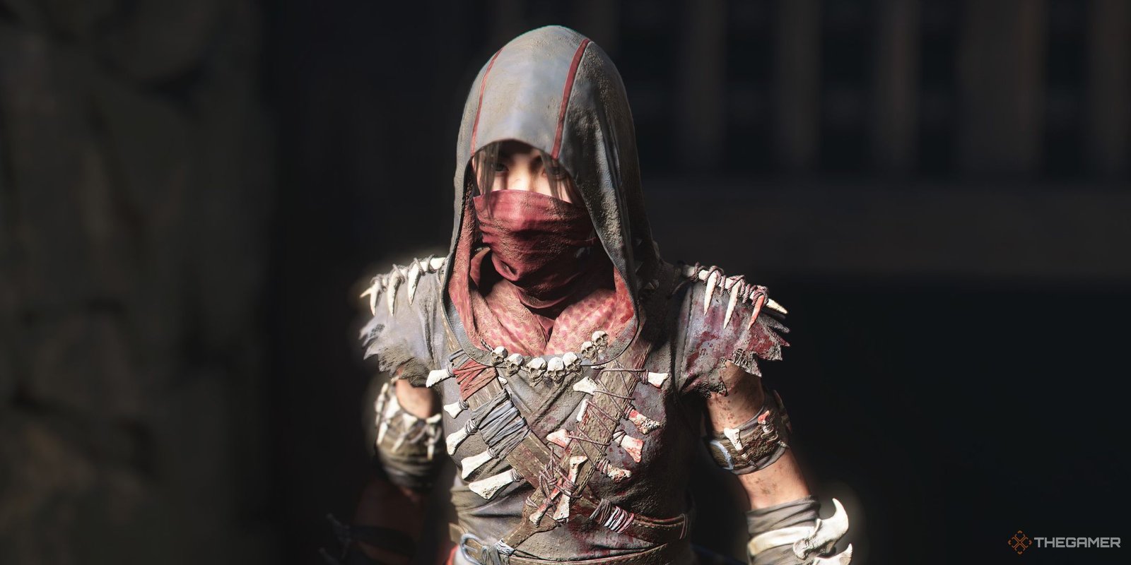Assassin's Creed Shadows screenshot of Naoe walking past a gate in a castle.